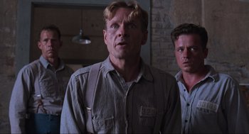 Movie still from “The Shawshank Redemption” (1994), directed by Frank Darabont – Medium shot, Low angle