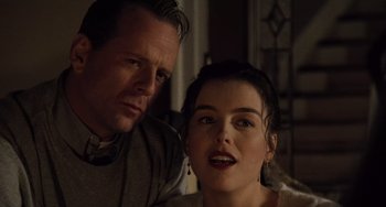 Movie still from “The Sixth Sense” (1999), directed by M. Night Shyamalan – A man and a woman sitting next to each other; Close Up shot, Low angle