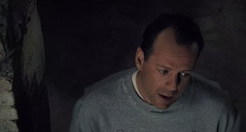 Movie still from “The Sixth Sense” (1999), directed by M. Night Shyamalan – A person wearing a sweater; Close Up shot, Overhead angle