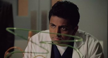 Movie still from “The Sixth Sense” (1999), directed by M. Night Shyamalan – A person wearing a lab coat; Close Up shot, Low angle