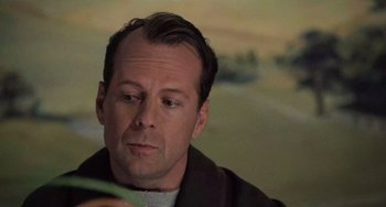 Movie still from “The Sixth Sense” (1999), directed by M. Night Shyamalan – A person looking at a cell phone; Close Up shot, Over the shoulder angle