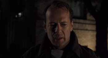 Movie still from “The Sixth Sense” (1999), directed by M. Night Shyamalan – A person wearing a jacket; Close Up shot, Low angle