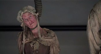 Movie still from “The Sixth Sense” (1999), directed by M. Night Shyamalan – A woman dressed as a witch in a costume; Close Up shot, Low angle