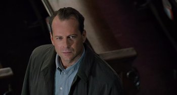 Movie still from “The Sixth Sense” (1999), directed by M. Night Shyamalan – A person wearing a jacket; Close Up shot, Low angle