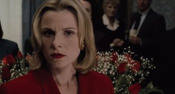 Movie still from “The Sixth Sense” (1999), directed by M. Night Shyamalan – A person wearing a suit and tie; Close Up shot, Over the shoulder angle