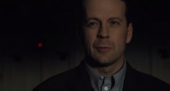 Movie still from “The Sixth Sense” (1999), directed by M. Night Shyamalan – A person wearing a suit; Close Up shot, Low angle