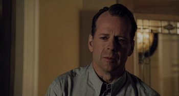 Movie still from “The Sixth Sense” (1999), directed by M. Night Shyamalan – A person wearing a shirt and tie; Close Up shot, Over the shoulder angle