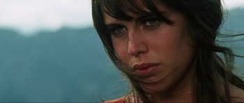 Movie still from “The Specialists” (1969), directed by Sergio Corbucci – A woman's face with long brown hair; Close Up shot, Low angle