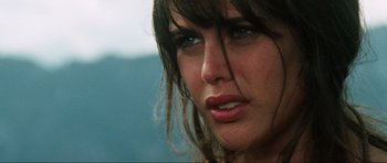 Movie still from “The Specialists” (1969), directed by Sergio Corbucci – A woman's face with long brown hair; Close Up shot, Over the shoulder angle