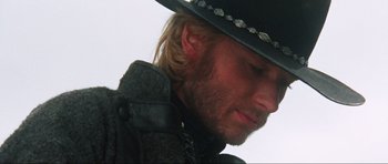 Movie still from “The Specialists” (1969), directed by Sergio Corbucci – A person wearing a cowboy hat; Close Up shot, Low angle