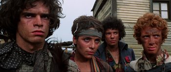 Movie still from “The Specialists” (1969), directed by Sergio Corbucci – A group of people standing next to each other on a street; Close Up shot, Low angle