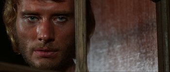 Movie still from “The Specialists” (1969), directed by Sergio Corbucci – A man's face in front of a mirror; Extreme Close Up shot, Over the shoulder angle