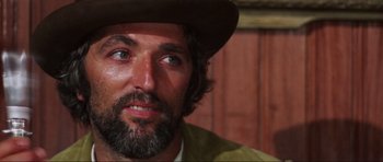 Movie still from “The Specialists” (1969), directed by Sergio Corbucci – A person wearing a hat; Close Up shot, Low angle