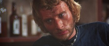 Movie still from “The Specialists” (1969), directed by Sergio Corbucci – A person with wet hair; Close Up shot, Low angle