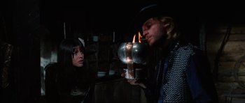 Movie still from “The Specialists” (1969), directed by Sergio Corbucci – A man and a woman are holding a metal object; Medium shot, Low angle