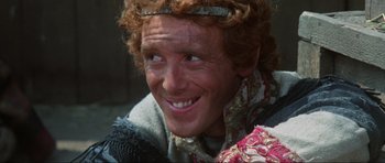 Movie still from “The Specialists” (1969), directed by Sergio Corbucci – A person wearing a crown; Close Up shot, Over the shoulder angle