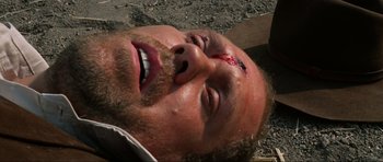 Movie still from “The Specialists” (1969), directed by Sergio Corbucci – A person with a head injury; Close Up shot, Overhead angle