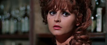 Movie still from “The Specialists” (1969), directed by Sergio Corbucci – A person wearing a dress; Close Up shot, Over the shoulder angle