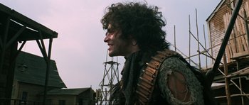 Movie still from “The Specialists” (1969), directed by Sergio Corbucci – A person wearing a costume; Medium shot, Low angle