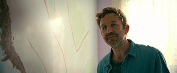 Movie still from “The Starling” (2021), directed by Theodore Melfi – A person standing in front of a wall; Close Up shot, Over the shoulder angle