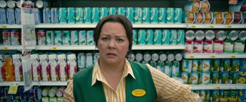 Movie still from “The Starling” (2021), directed by Theodore Melfi – A woman standing in front of a shelf; Medium shot, Low angle