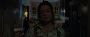 Movie still from “The Starling” (2021), directed by Theodore Melfi – A person wearing a floral shirt; Close Up shot, Low angle