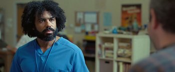 Movie still from “The Starling” (2021), directed by Theodore Melfi – A man in a blue shirt is standing in a room; Close Up shot, Over the shoulder angle