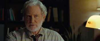 Movie still from “The Starling” (2021), directed by Theodore Melfi – An older man with white hair wearing a plaid shirt; Close Up shot, Over the shoulder angle
