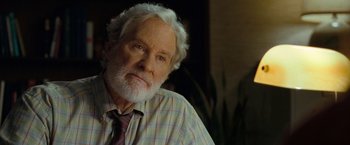 Movie still from “The Starling” (2021), directed by Theodore Melfi – An older man with white hair wearing a plaid shirt; Close Up shot, Over the shoulder angle