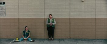 Movie still from “The Starling” (2021), directed by Theodore Melfi – A woman standing in front of a wall; Wide shot, Low angle