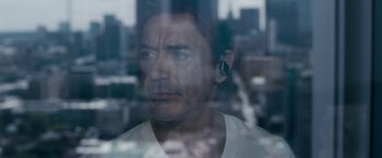 Movie still from “Due Date” (2010), directed by Todd Phillips – A person wearing a ear piece; Close Up shot, Low angle