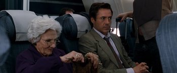 Movie still from “Due Date” (2010), directed by Todd Phillips – A man and a woman sitting on a plane; Close Up shot, Over the shoulder angle