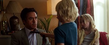 Movie still from “Due Date” (2010), directed by Todd Phillips – A man and a boy in a living room; Close Up shot, Over the shoulder angle