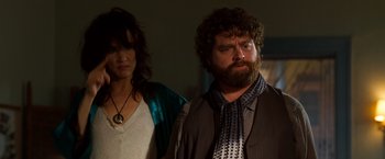 Movie still from “Due Date” (2010), directed by Todd Phillips – A man and a woman standing next to each other in a room; Close Up shot, Low angle