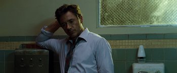 Movie still from “Due Date” (2010), directed by Todd Phillips – A man in a white shirt and a blue tie; Close Up shot, Over the shoulder angle