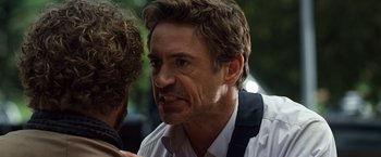 Movie still from “Due Date” (2010), directed by Todd Phillips – A person talking to another person; Close Up shot, Over the shoulder angle