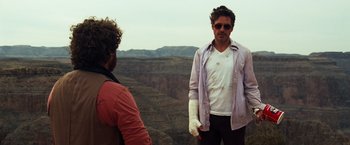Movie still from “Due Date” (2010), directed by Todd Phillips – Two men standing on top of a mountain looking at each other; Medium shot, Over the shoulder angle