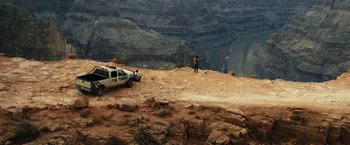 Movie still from “Due Date” (2010), directed by Todd Phillips – A white truck parked on top of a mountain; Extreme Wide shot, High angle