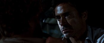 Movie still from “Due Date” (2010), directed by Todd Phillips – A man's face in the dark; Close Up shot, Over the shoulder angle