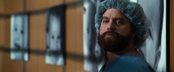 Movie still from “Due Date” (2010), directed by Todd Phillips – A man with a beard wearing a surgical cap; Close Up shot, Low angle
