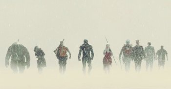 Movie still from “The Suicide Squad” (2021), directed by James Gunn – A group of people standing in the middle of a snow storm; Wide shot, Low angle