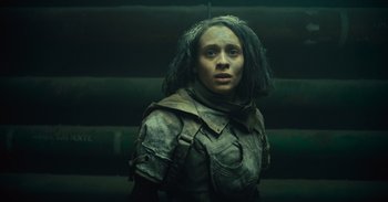 Movie still from “The Suicide Squad” (2021), directed by James Gunn – A woman in a leather jacket and a wig; Close Up shot, Low angle