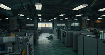 Movie still from “The Suicide Squad” (2021), directed by James Gunn – An empty room with a refrigerator and a window; Extreme Wide shot, High angle