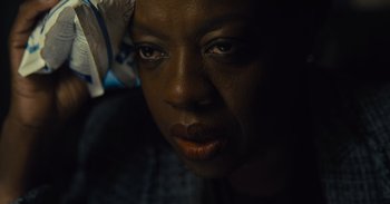 Movie still from “The Suicide Squad” (2021), directed by James Gunn – A woman's face in the dark; Close Up shot, High angle