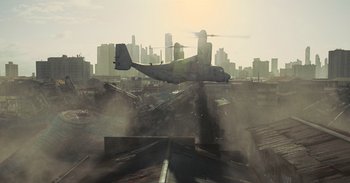 Movie still from “The Suicide Squad” (2021), directed by James Gunn – An airplane is flying over a train yard; Extreme Wide shot, High angle