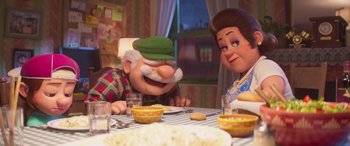 Movie still from “The Super Mario Bros. Movie” (2023), directed by Aaron Horvath – Two people sitting at a table with a bowl of popcorn; Medium shot, Over the shoulder angle