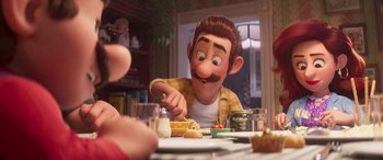 Movie still from “The Super Mario Bros. Movie” (2023), directed by Aaron Horvath – A man with a mustache is sitting at a dinner table; Close Up shot, Over the shoulder angle