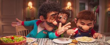 Movie still from “The Super Mario Bros. Movie” (2023), directed by Aaron Horvath – A man and a woman sitting at a dinner table; Medium shot, Over the shoulder angle