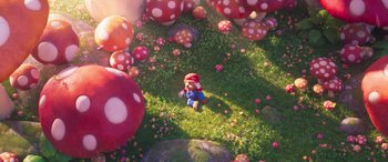 Movie still from “The Super Mario Bros. Movie” (2023), directed by Aaron Horvath – An overhead view of a person in a field of mushrooms; Extreme Wide shot, High angle