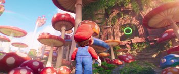 Movie still from “The Super Mario Bros. Movie” (2023), directed by Aaron Horvath – A person standing in front of a bunch of mushrooms; Wide shot, Over the shoulder angle